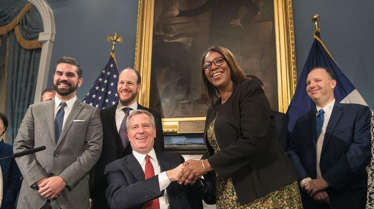 Mayor Bill de Blasio shakes hands with Tish James, New...