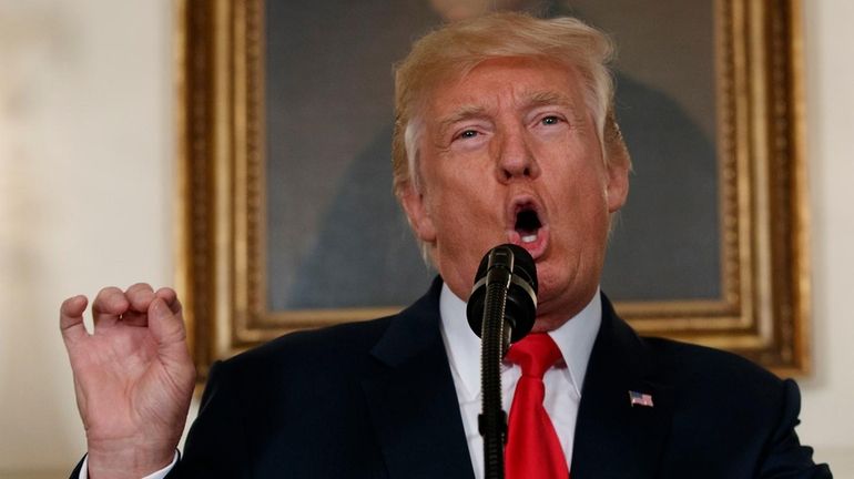 President Donald Trump speaks in the White House in Washington,...