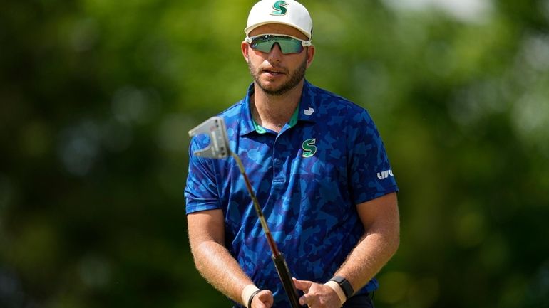 Dean Burmester, of South Africa, reacts after missing a putt...