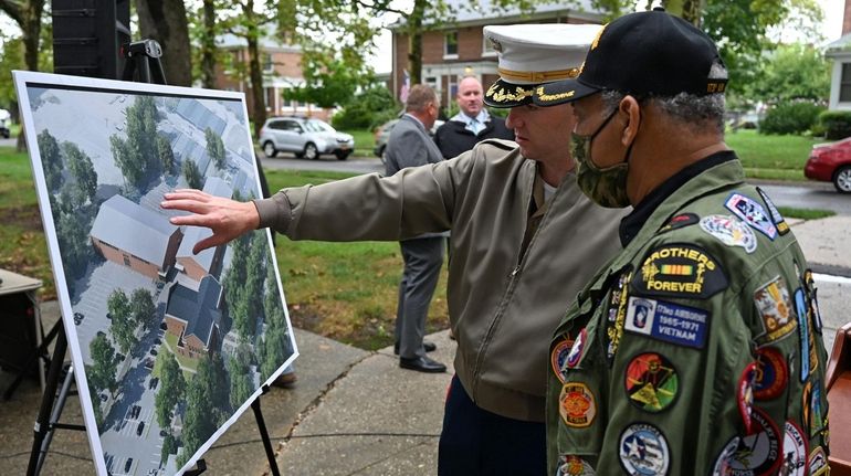 From left: U.S. Marine Corps. Maj. Stephen Desmond and Herbert Sweat,...