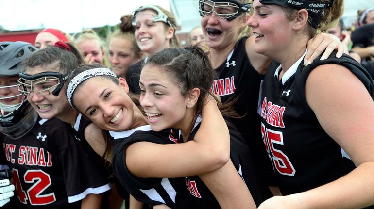 Mount Sinai's Leah Nonnenman, left, hugs Rayna Sabella following their...