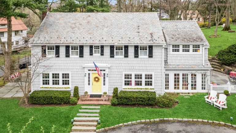 This 1920s Sea Cliff home and adjacent cottage is on...