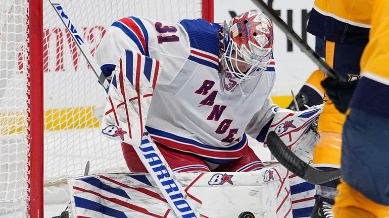 New York Rangers goaltender Igor Shesterkin (31) blocks a shot...