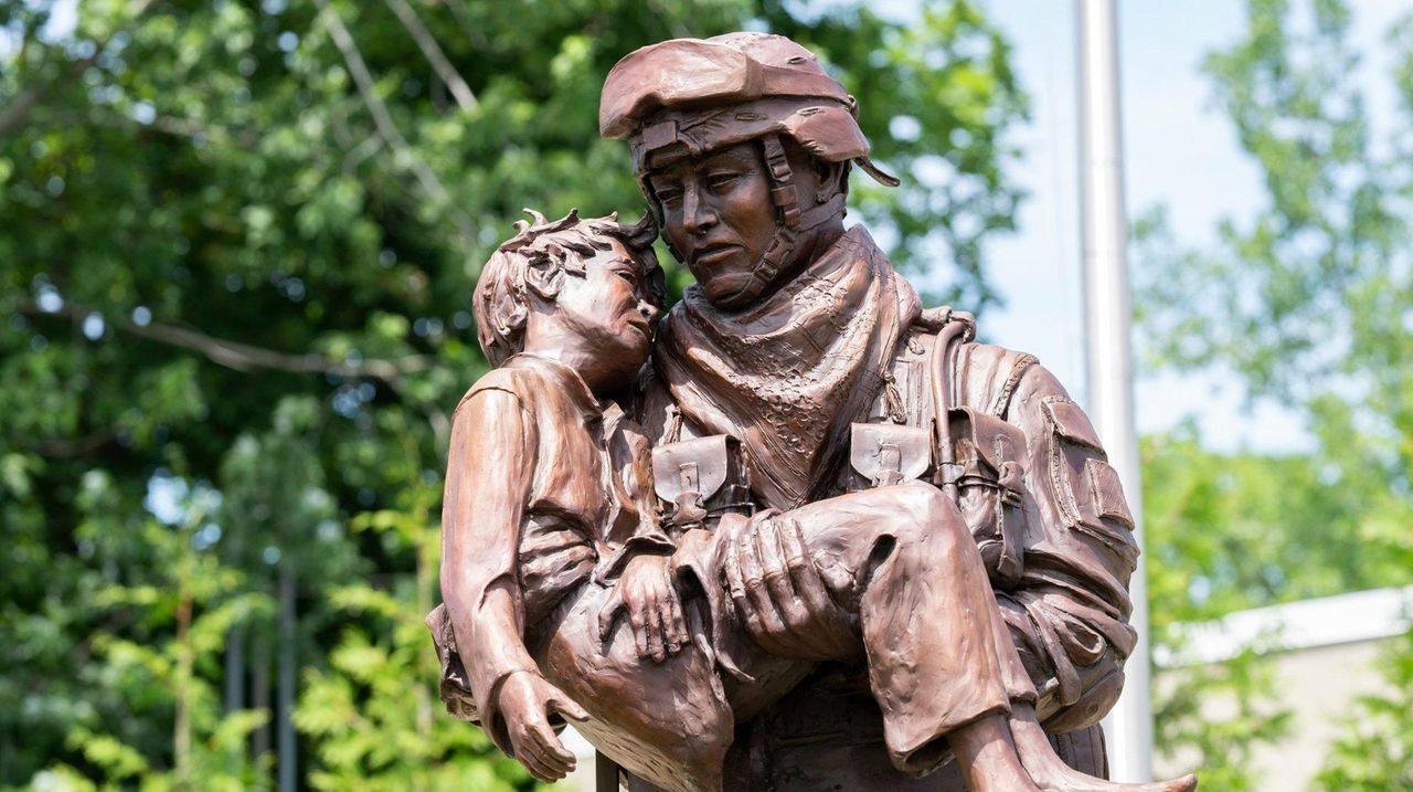 Statue depicts courage, horror - Newsday