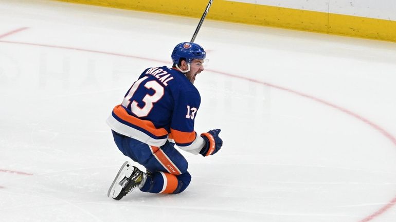 Mathew Barzal celebrates his winning goal in Game 4 against...