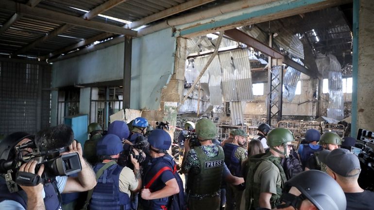 Journalists visit the destroyed barracks at the Russian-controlled Olenivka prison...