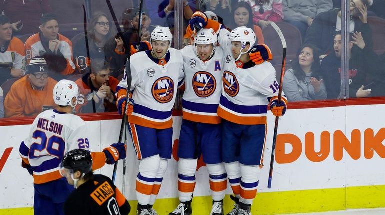 New York Islanders' Andrew Ladd (16), Josh Bailey (12), Adam...