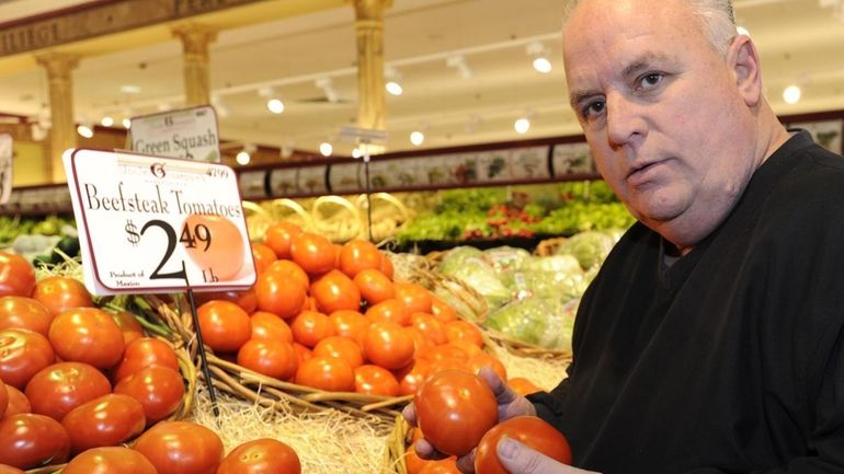 Thomas Barresi, co-owner of Uncle Giuseppe's Marketplace in Smithtown, holds...