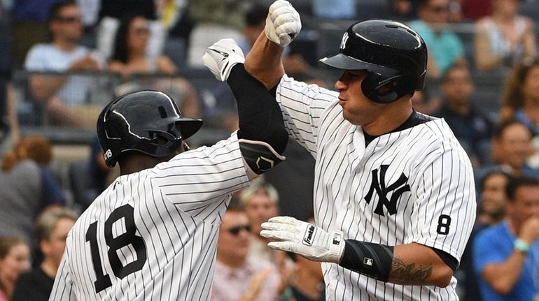 New York Yankees shortstop Didi Gregorius greets Yankees catcher Gary...