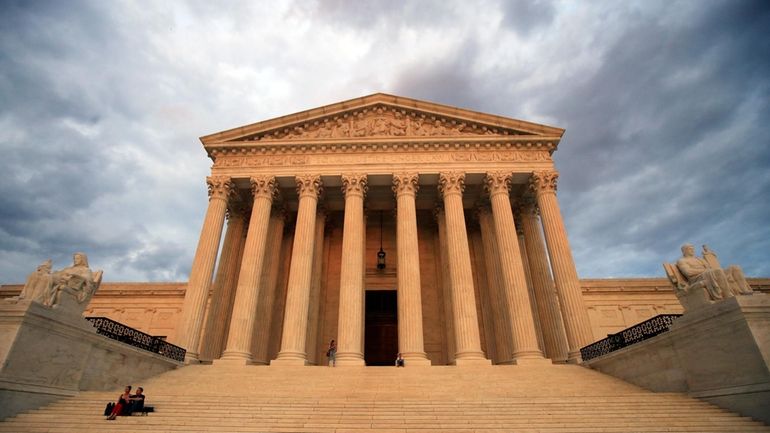 The U.S. Supreme Court is seen at near sunset in...