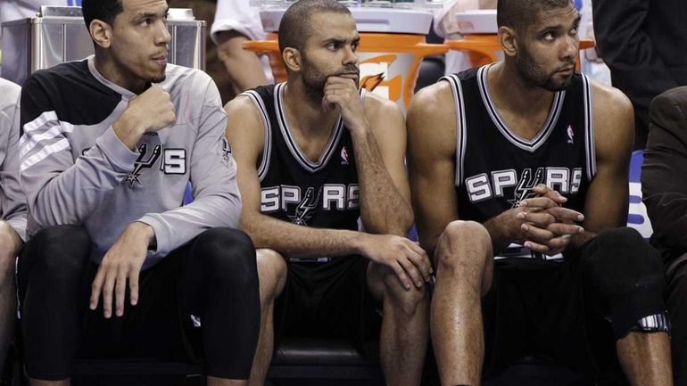 From left, San Antonio Spurs' Danny Green, Tony Parker and...