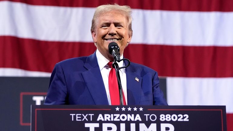 Republican presidential nominee former President Donald Trump speaks during a...