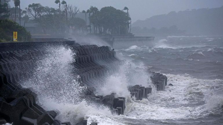 High waves hit a coastal area in Ibusuki, Kagoshima prefecture,...