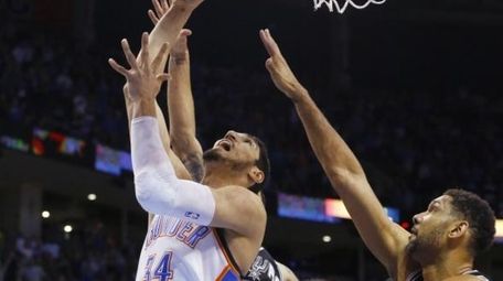 Oklahoma City Thunder center Enes Kanter (34) shoots