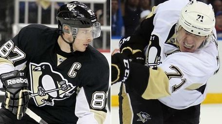 The Pittsburgh Penguins' Sidney Crosby, left, and Evgeni