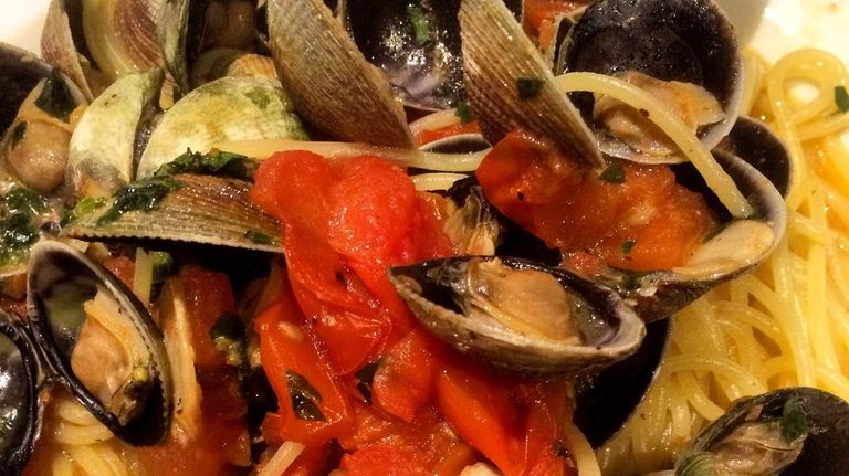 Spaghetti and clam sauce is served at the
