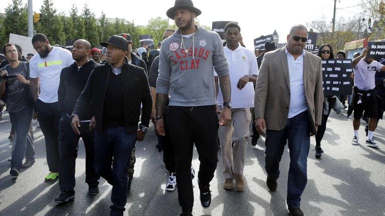 Carmelo Anthony, marching in Baltimore, urges calm and patience ...