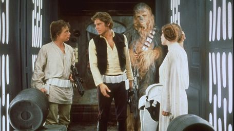 Mark Hamill, Harrison Ford and Carrie Fisher in