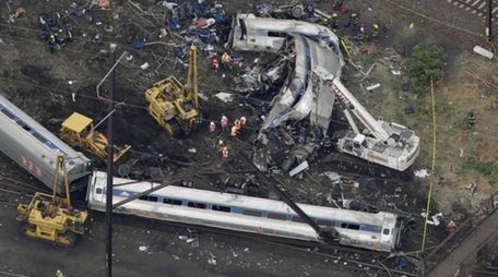 In this aerial photo, emergency personnel work at