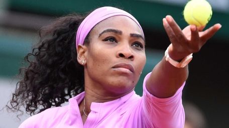 Serena Williams serves to Andrea Hlavackova during the