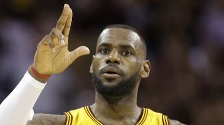 Cleveland Cavaliers forward LeBron James (23) celebrates a