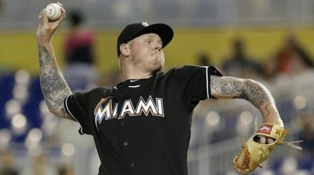 The Miami Marlins' Mat Latos delivers a pitch