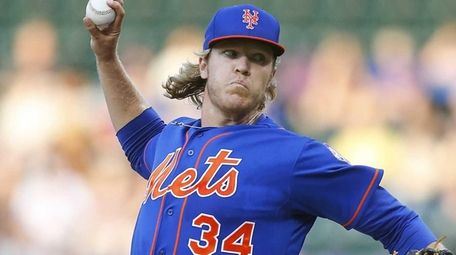 Noah Syndergaard of the New York Mets pitches