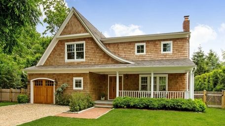 This four-bedroom, shingle-style traditional down the block from