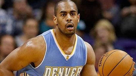 Arron Afflalo of the Denver Nuggets handles the