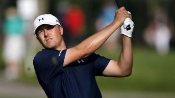 Jordan Spieth watches his approach shot on the