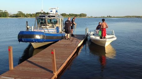 Suffolk Marine Bureau officers rescued three people from