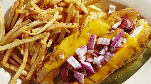 The Decadent Dog with cheese, red onion, and