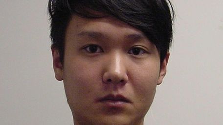 Bing Jie Yang, 23, of Westbury, is accused