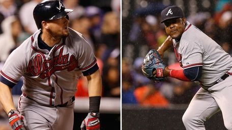 Kelly Johnson, left, and Juan Uribe, right, were