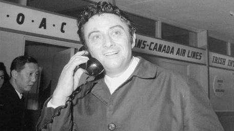 Comedian Lenny Bruce speaks to Customs officials at