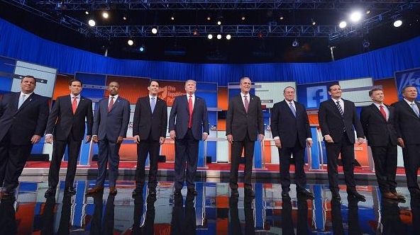 Republican presidential candidates arrive on stage for the
