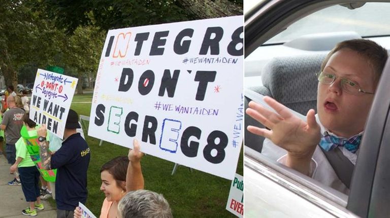 Protesters who support Aiden Killoran, right in car,