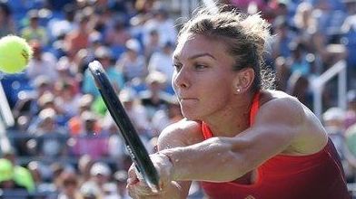 Simona Halep, of Romania, returns a shot to