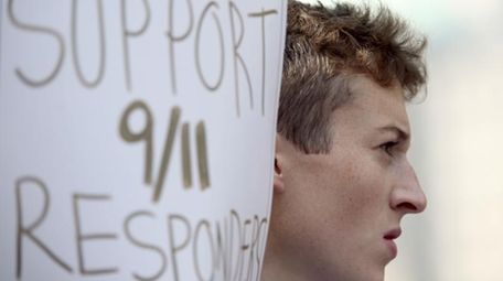 An activist holds a sign in support of