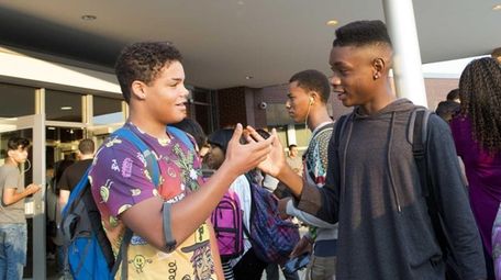 Students greet each other outside the Ross Center