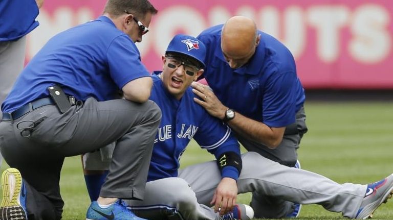 Toronto Blue Jays staff tend to Toronto Blue