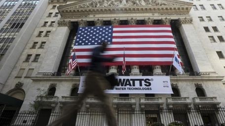 A visitor to the financial district walks past
