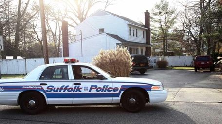 A Suffolk police car sits in front of