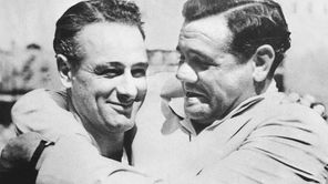 Babe Ruth, right, hugs Lou Gehrig during an