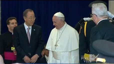 UN Secretary-General Ban Ki-moon escorts Pope Francis off