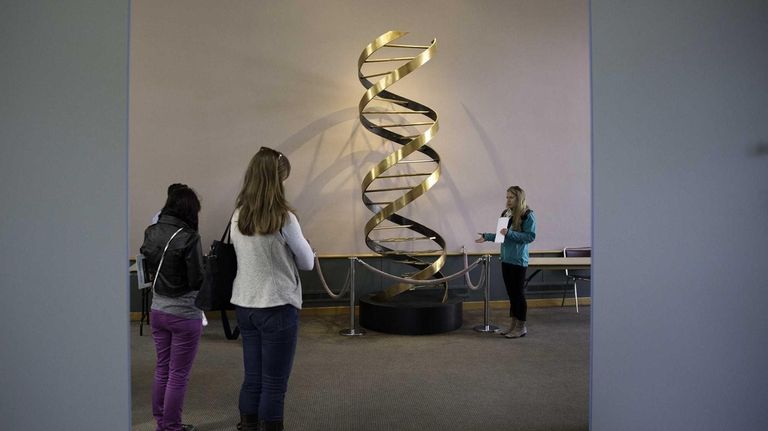 A floor-to-ceiling replica of Nobel laureates James Watson