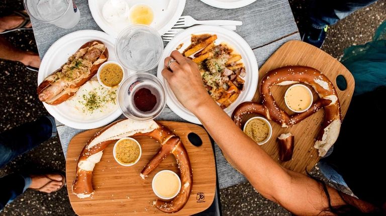 Traditional German pretzels and bratwurst are served at
