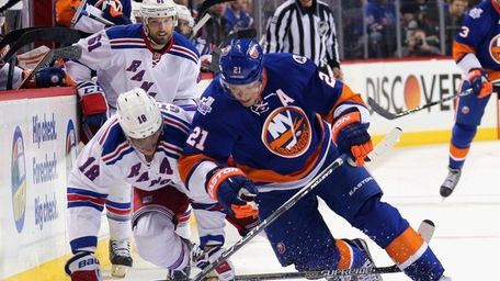 Marc Staal of the New York Rangers trips