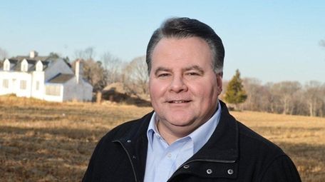 Frederick Giachetti stands on the land where he