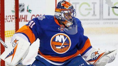 Jaroslav Halak of the New York Islanders makes